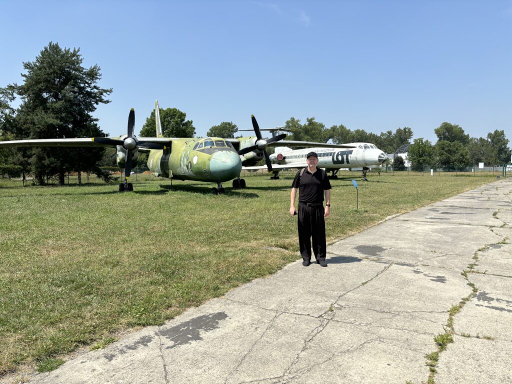 a man standing in front of an airplane