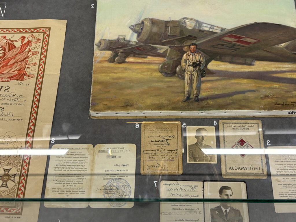 a display case with pictures and papers