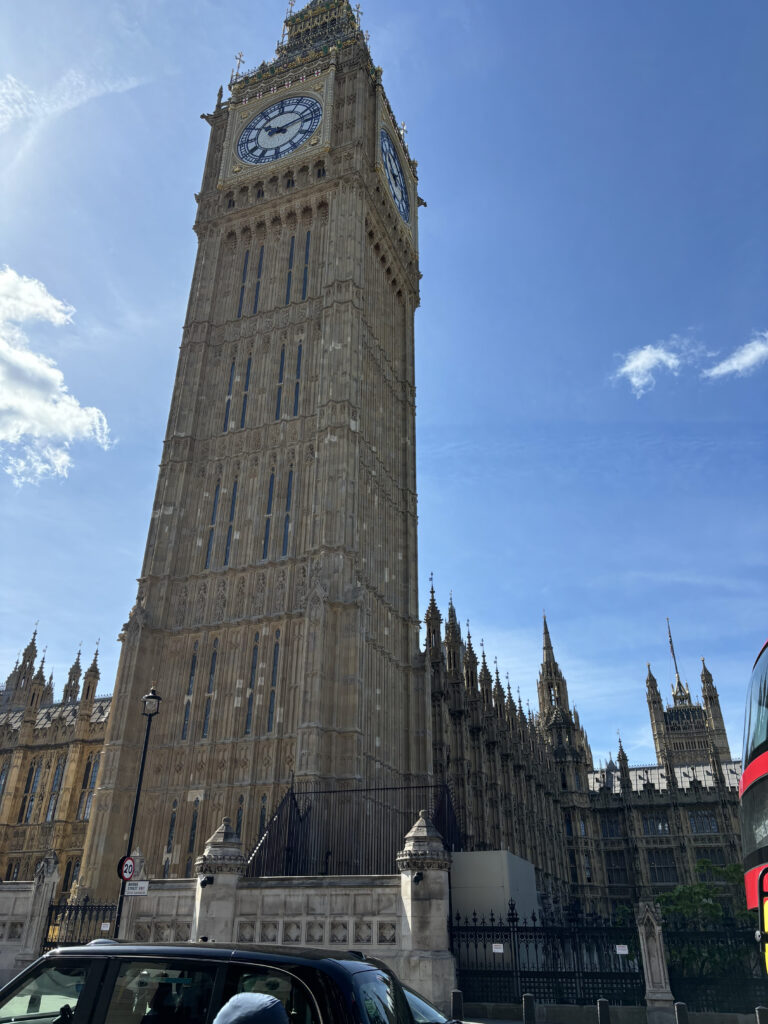 a clock tower in front of a building