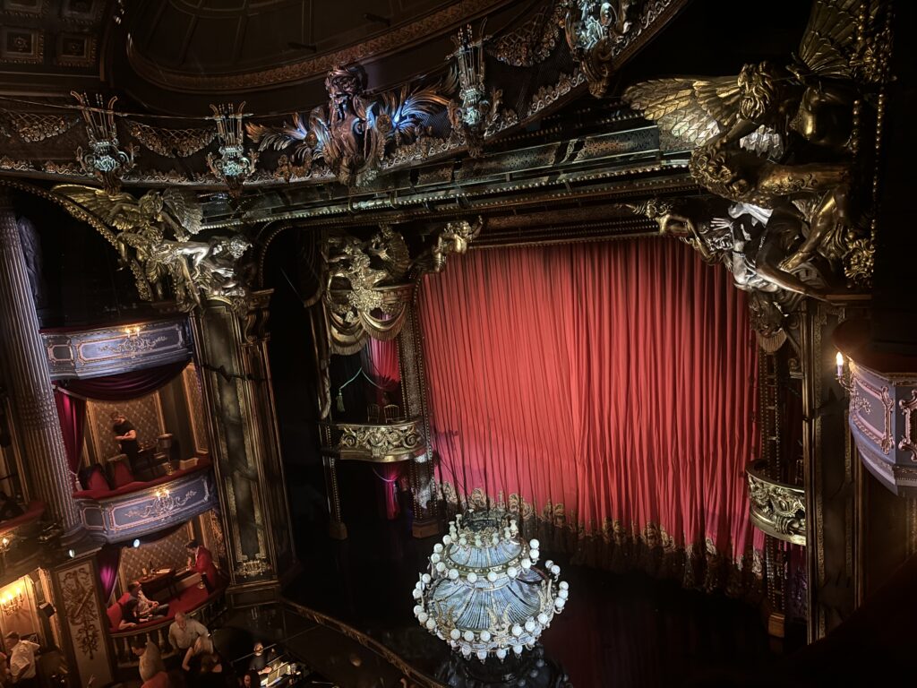 a stage with a chandelier and a chandelier
