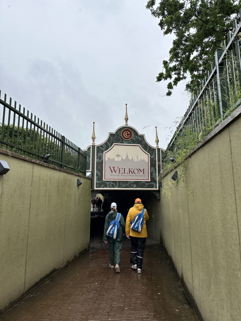 people walking into a tunnel