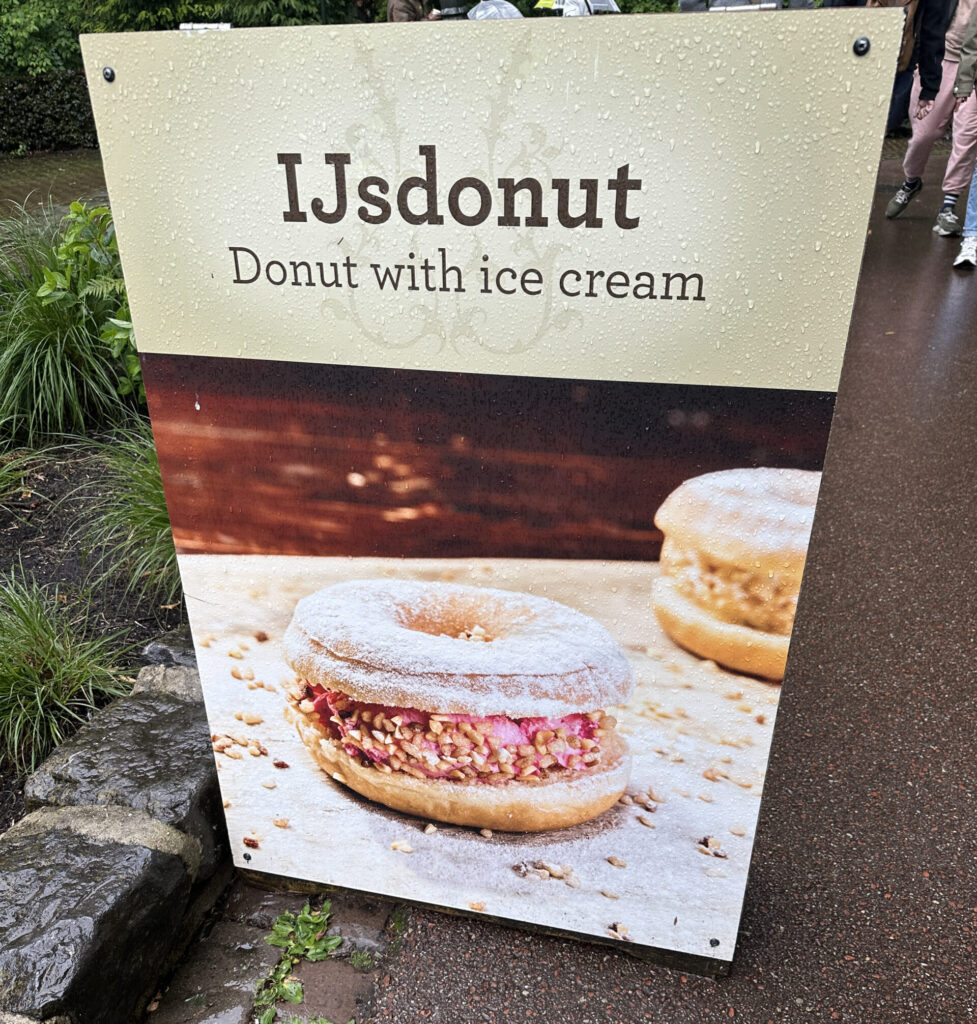 a sign with a picture of donuts