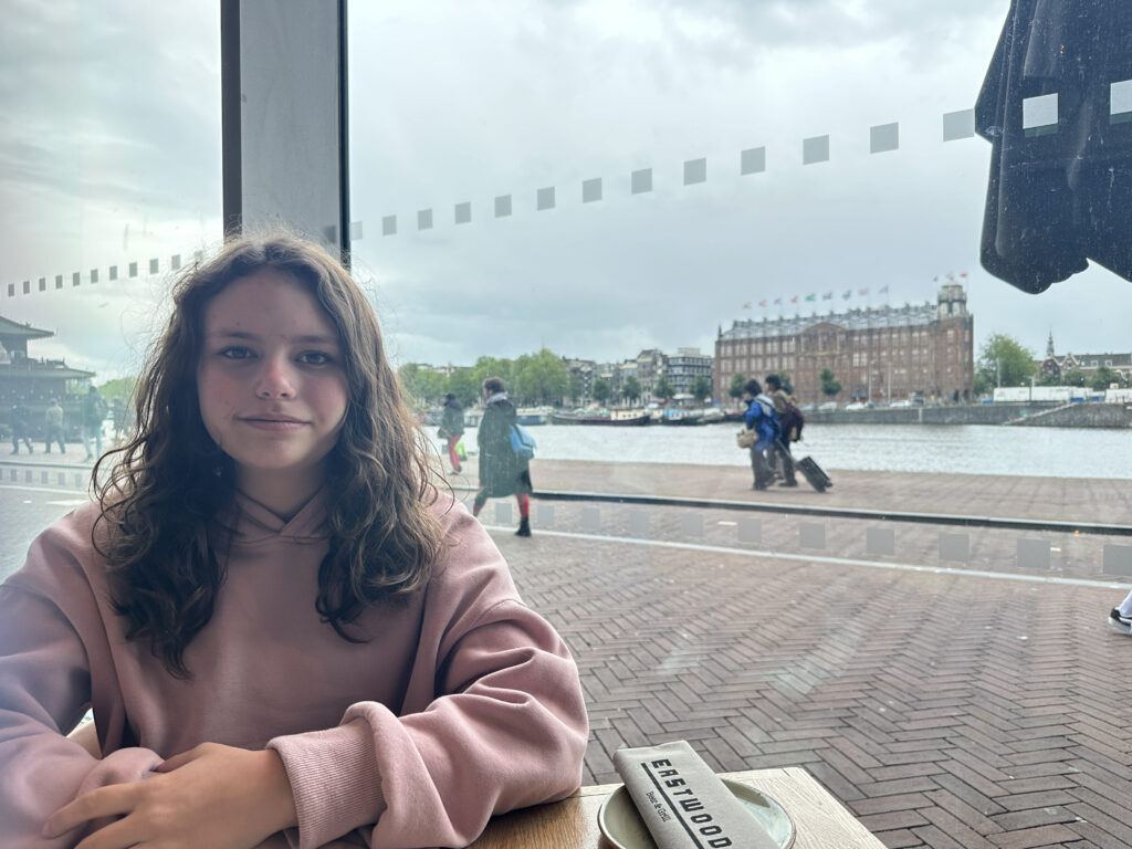 a girl sitting at a table