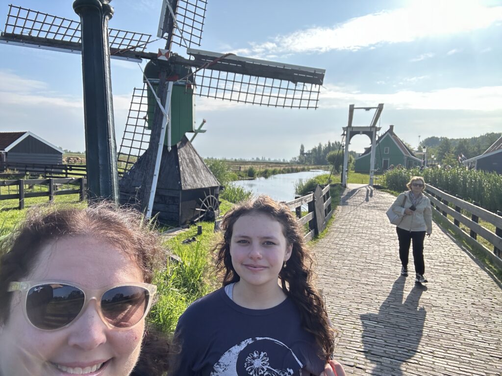 a woman and a girl posing for a picture