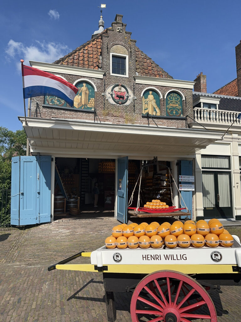 a cart full of oranges outside a building