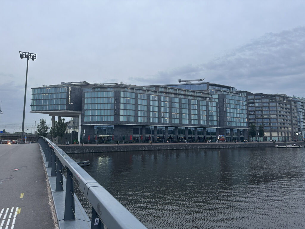 a building next to a body of water