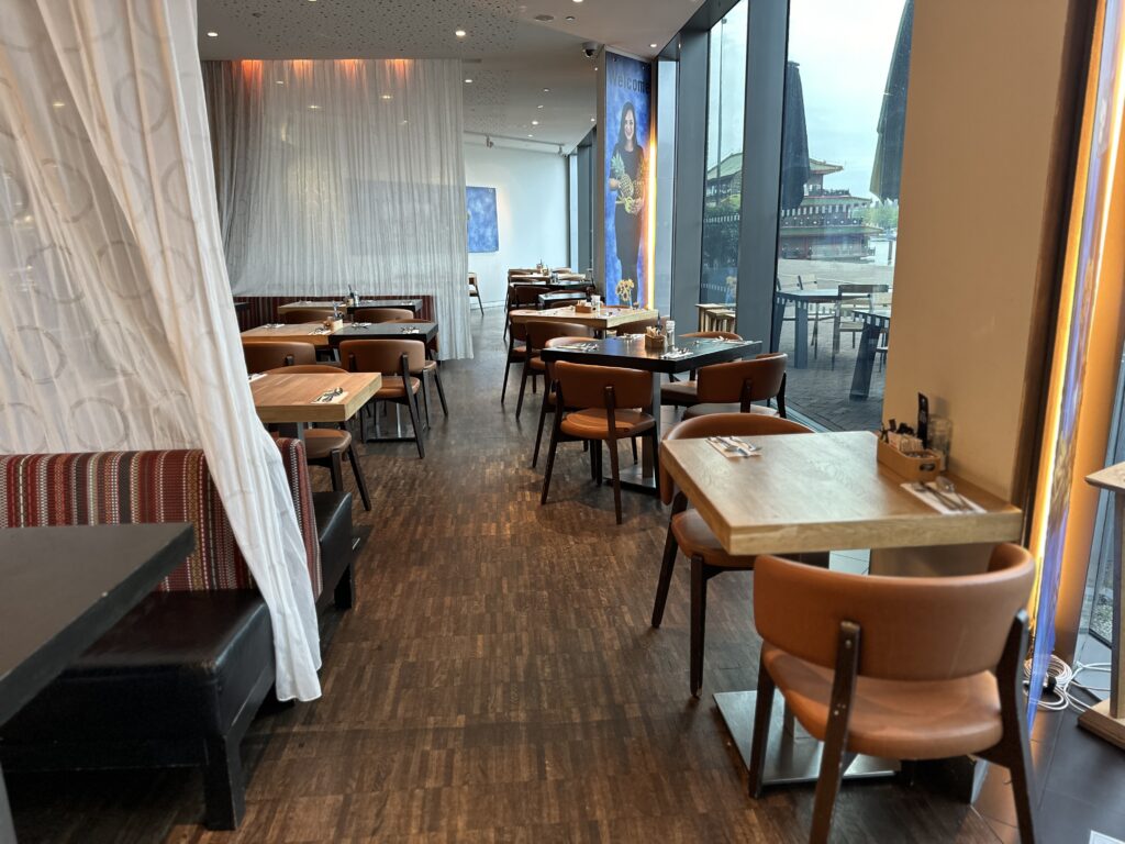 a restaurant with tables and chairs