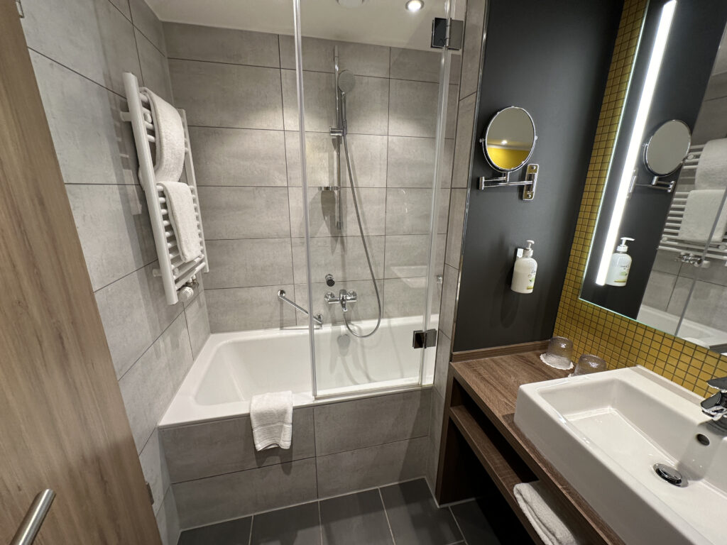 a bathroom with a glass shower door