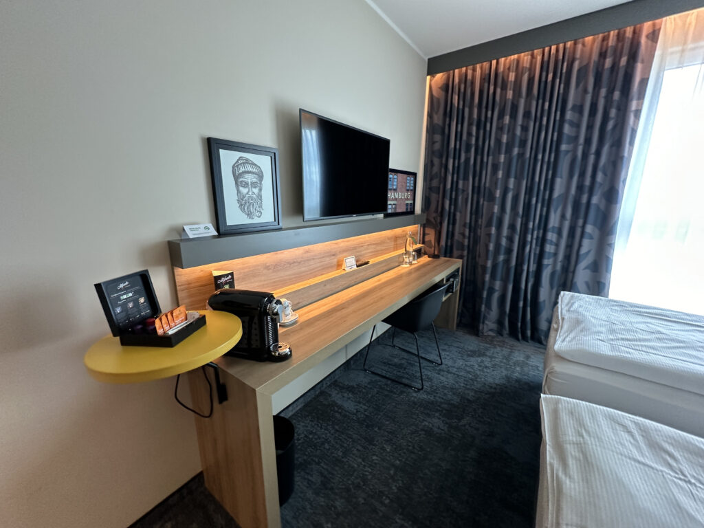 a room with a desk and a television