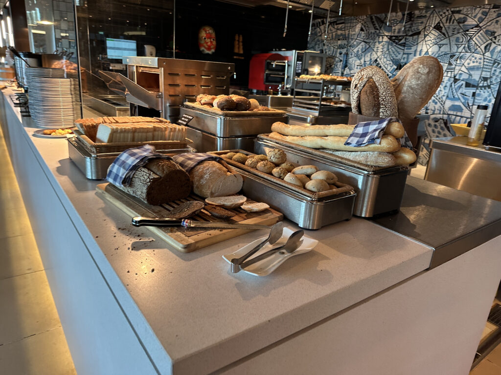 a counter with different types of bread on it