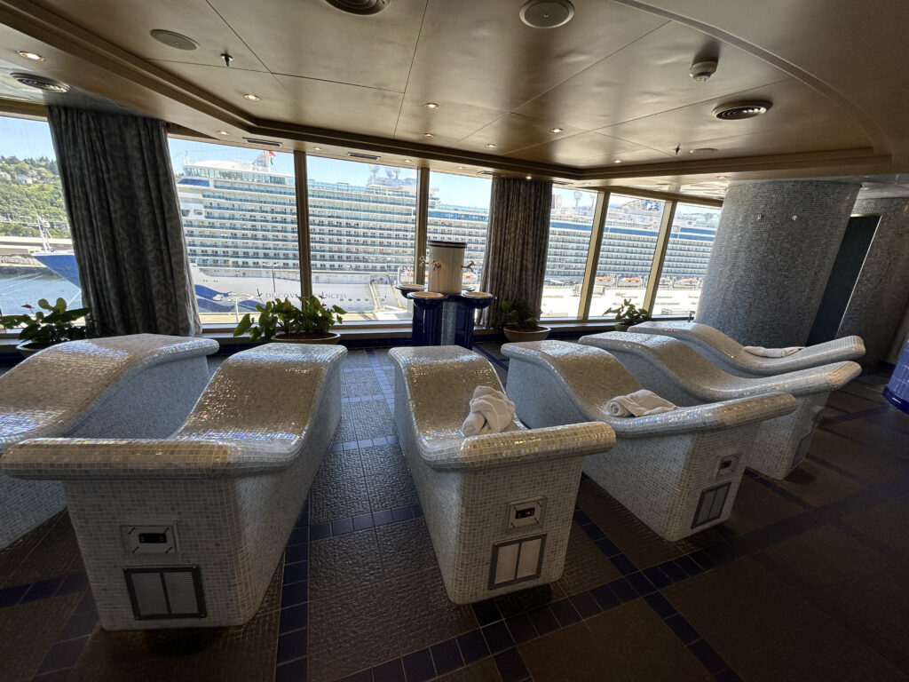 a room with white tubs and a large window