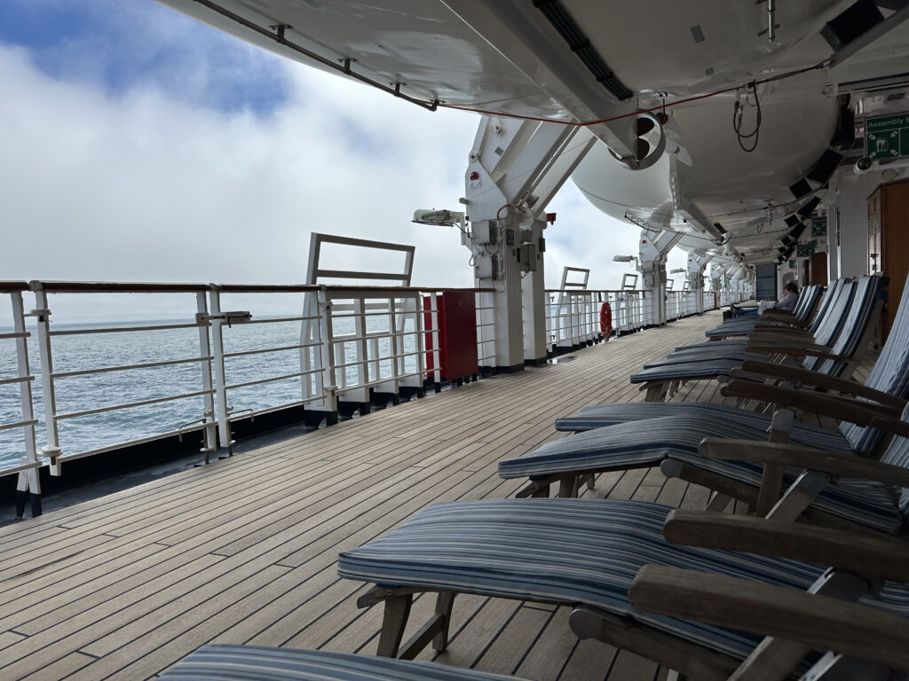 a deck of a cruise ship with chairs on it