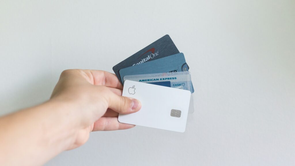 a hand holding a credit card