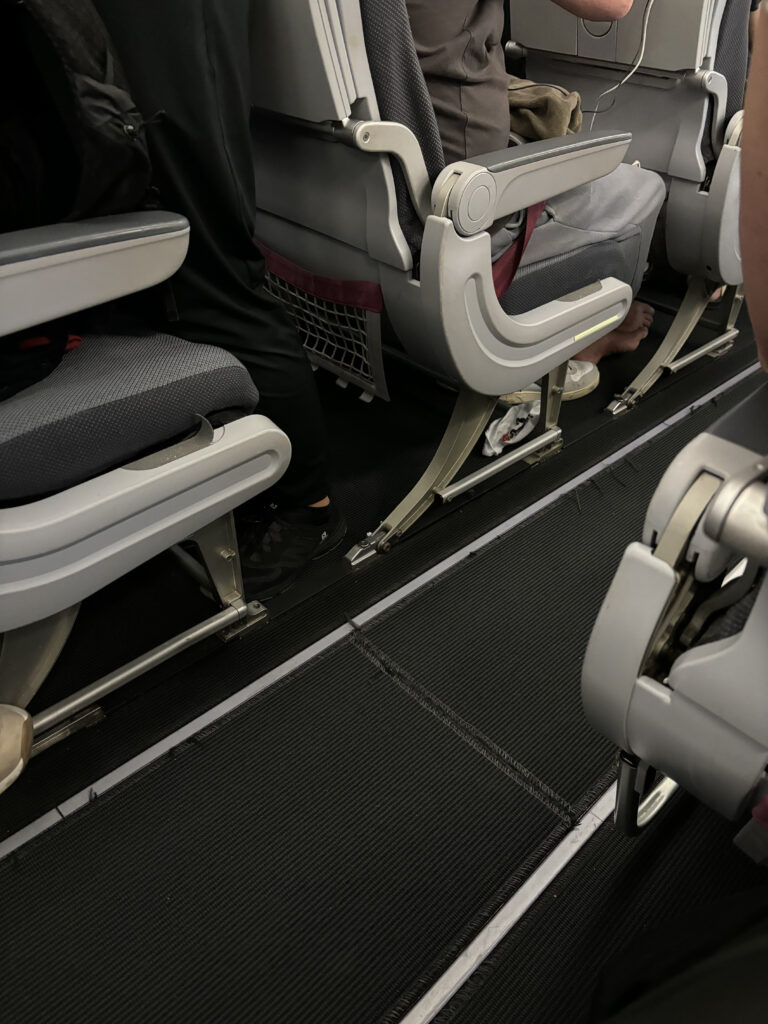 a group of people sitting in an airplane