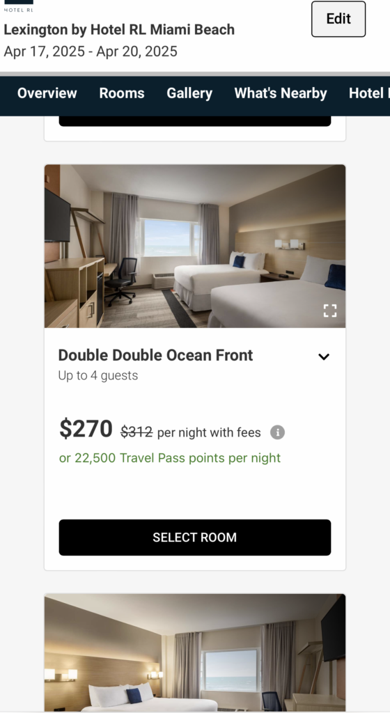 screenshot of a hotel room with two beds and a desk