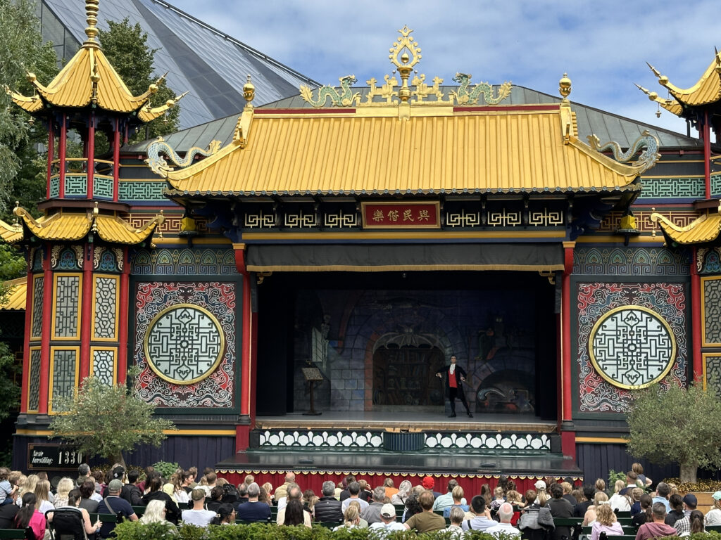 a stage with a crowd of people watching