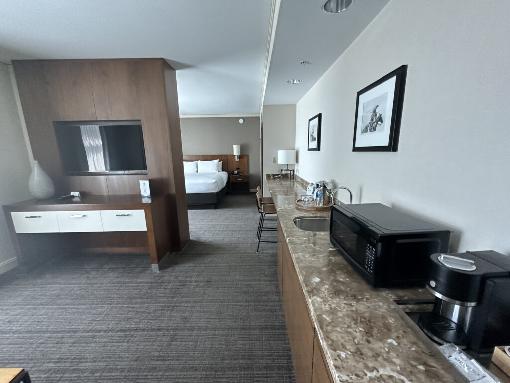a room with a television and a microwave