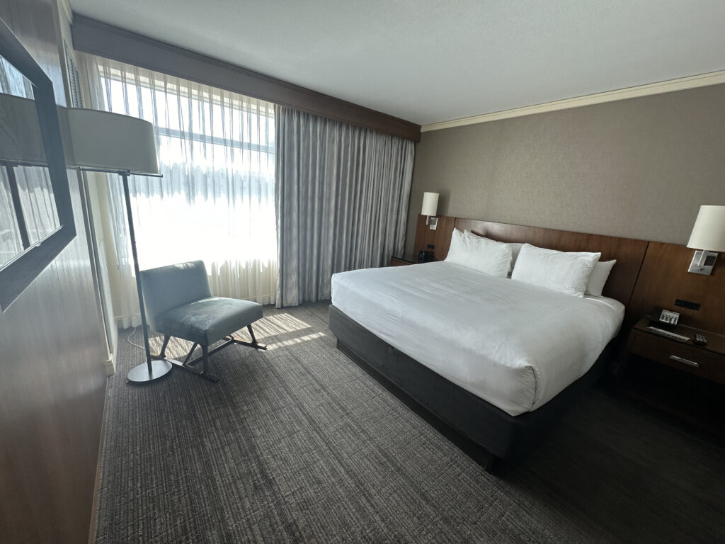 a room with a bed and a chair