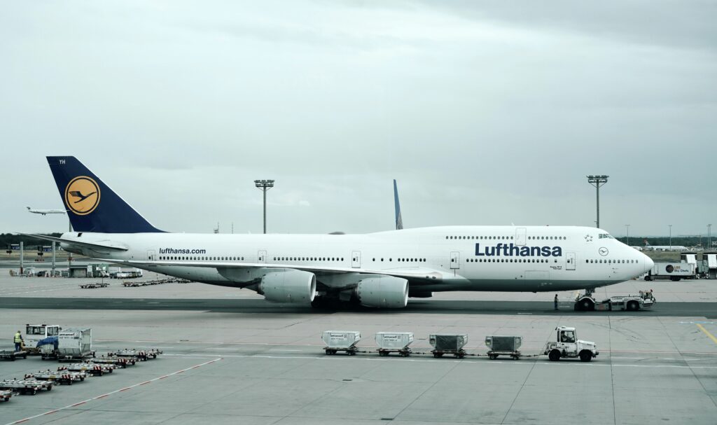 a large white airplane on a runway