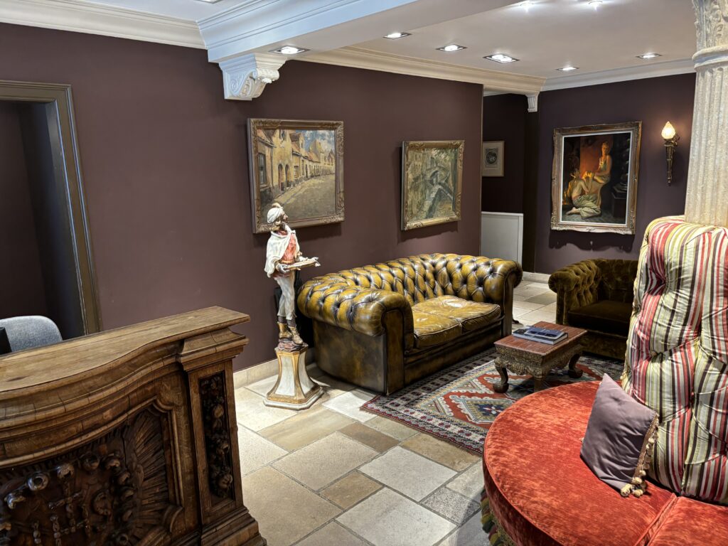 a room with a couch and a statue