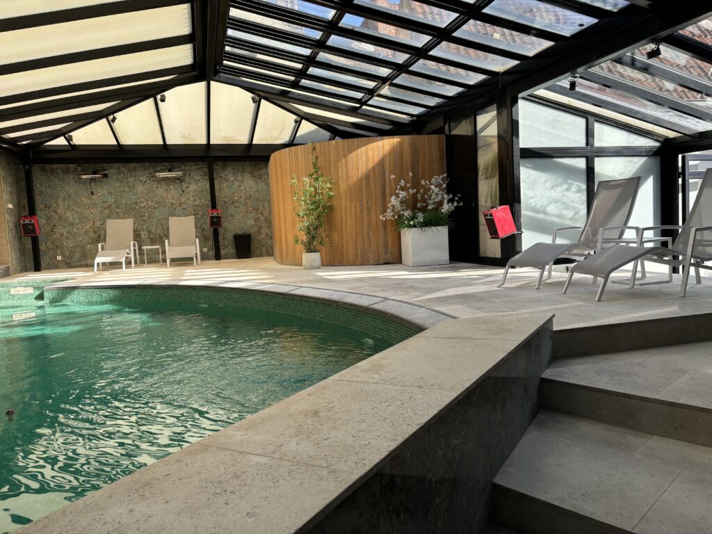 a pool with a glass roof
