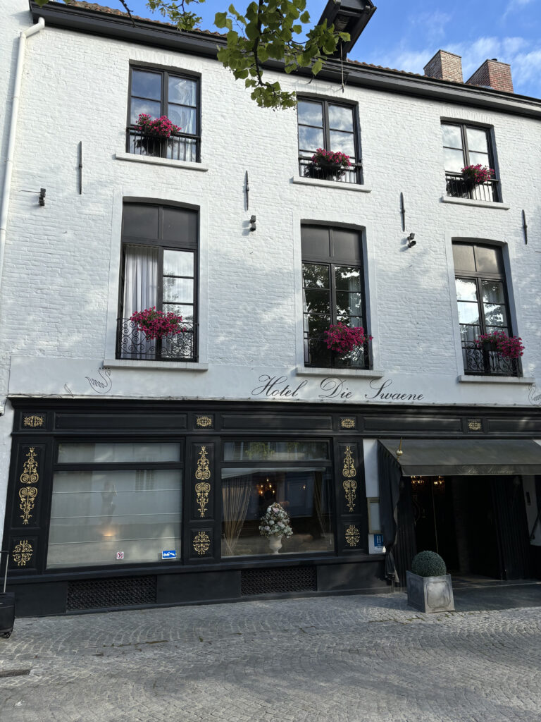 a building with windows and flowers on the windows
