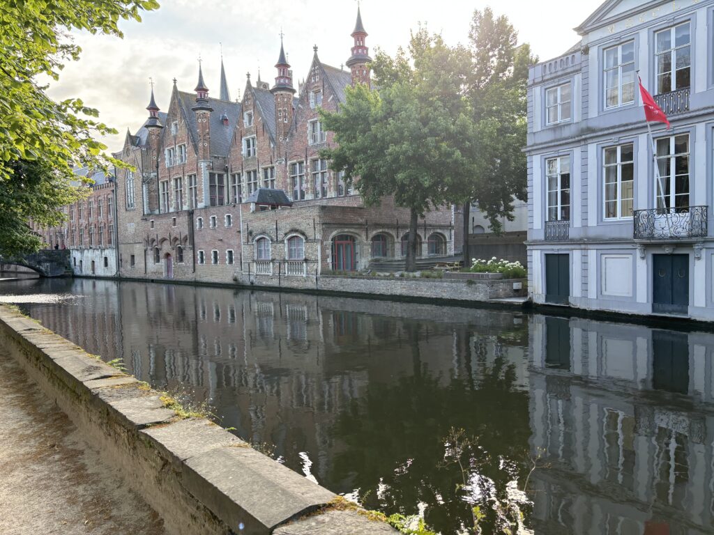 a water way with buildings and trees