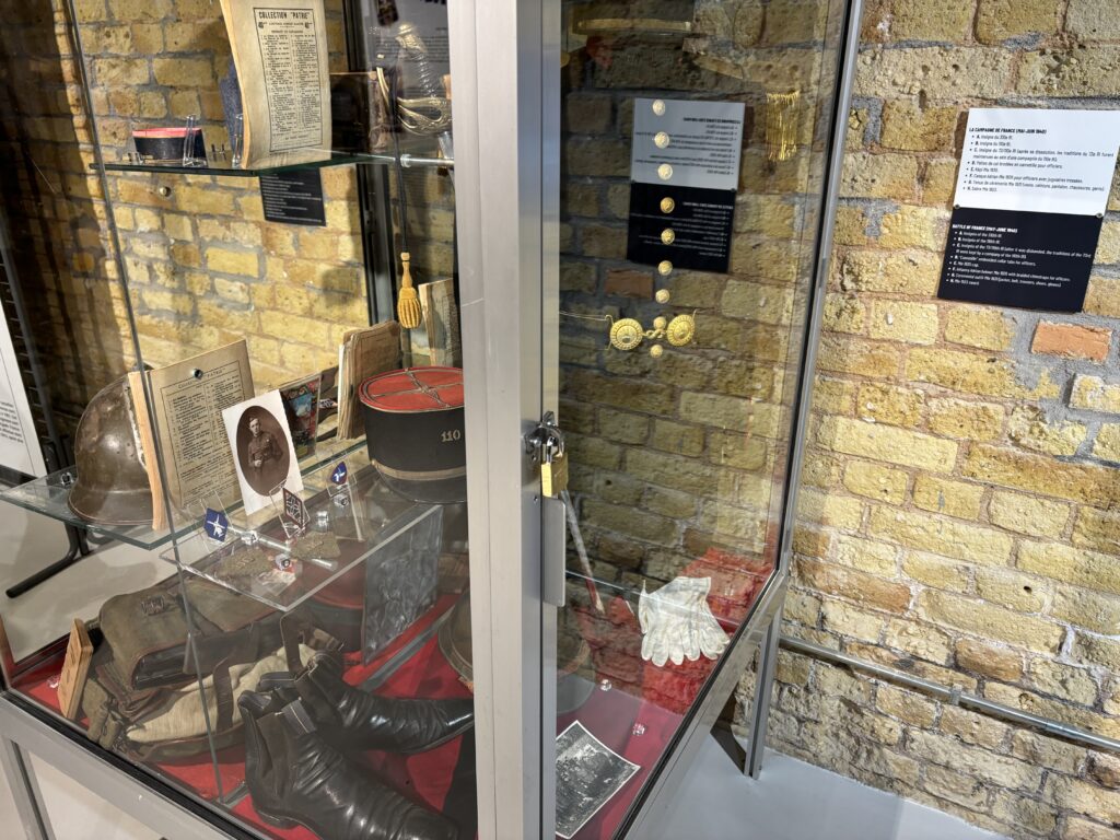 a glass case with a display case and a brick wall