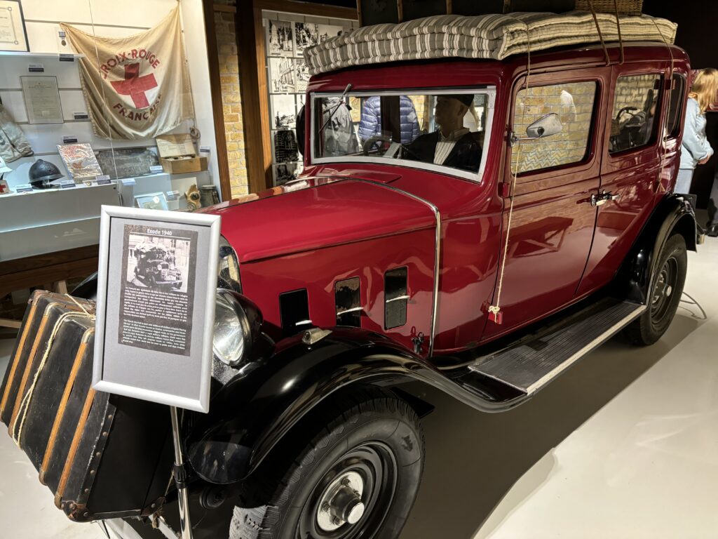 a red car with a sign on the front