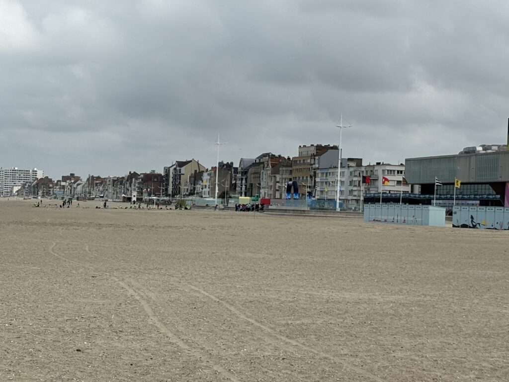 a beach with buildings and buildings in the background