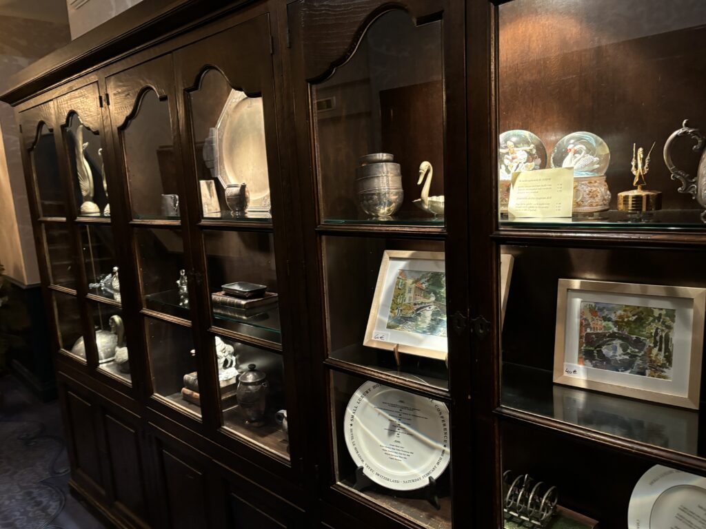 a display case with glass doors and plates