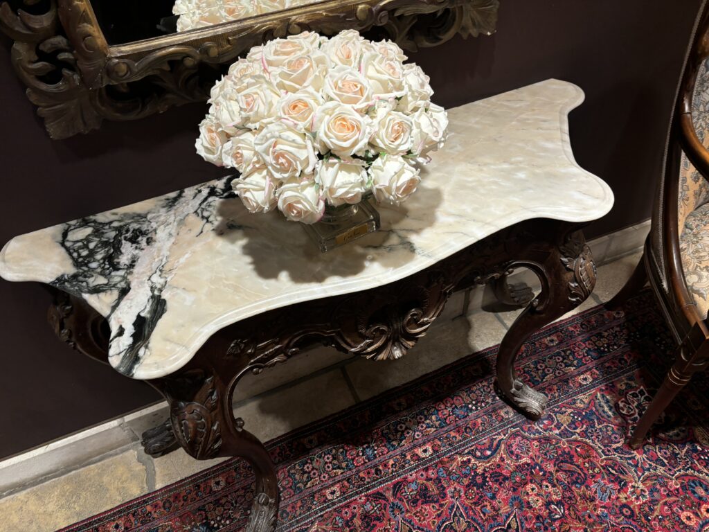 a bouquet of roses on a marble table