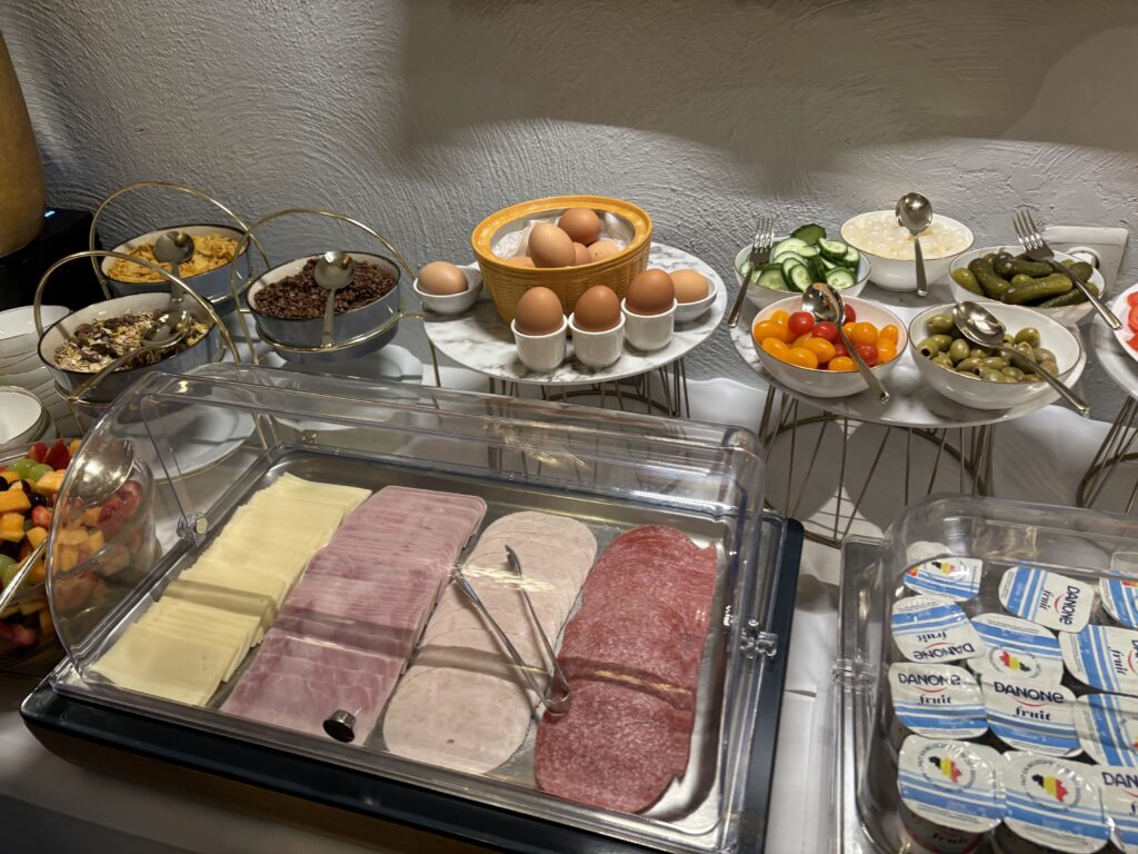a buffet table with food and eggs