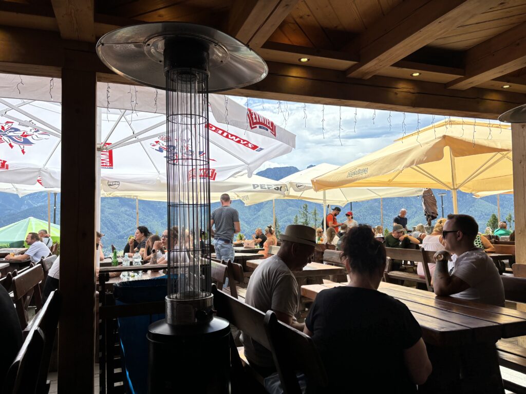 a group of people sitting at tables