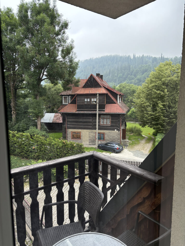 a house with a fence and trees