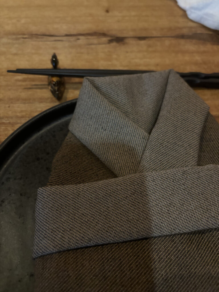 a folded napkin on a plate