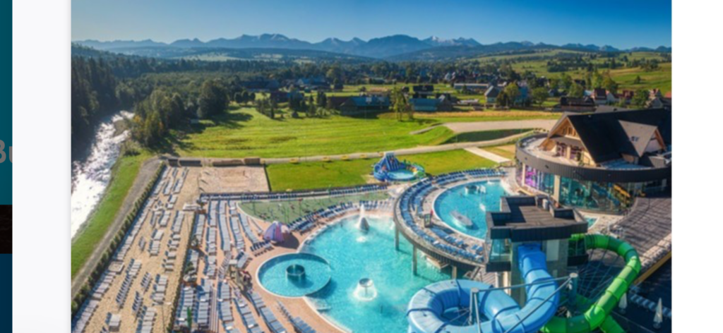 a water park with a pool and a water slide