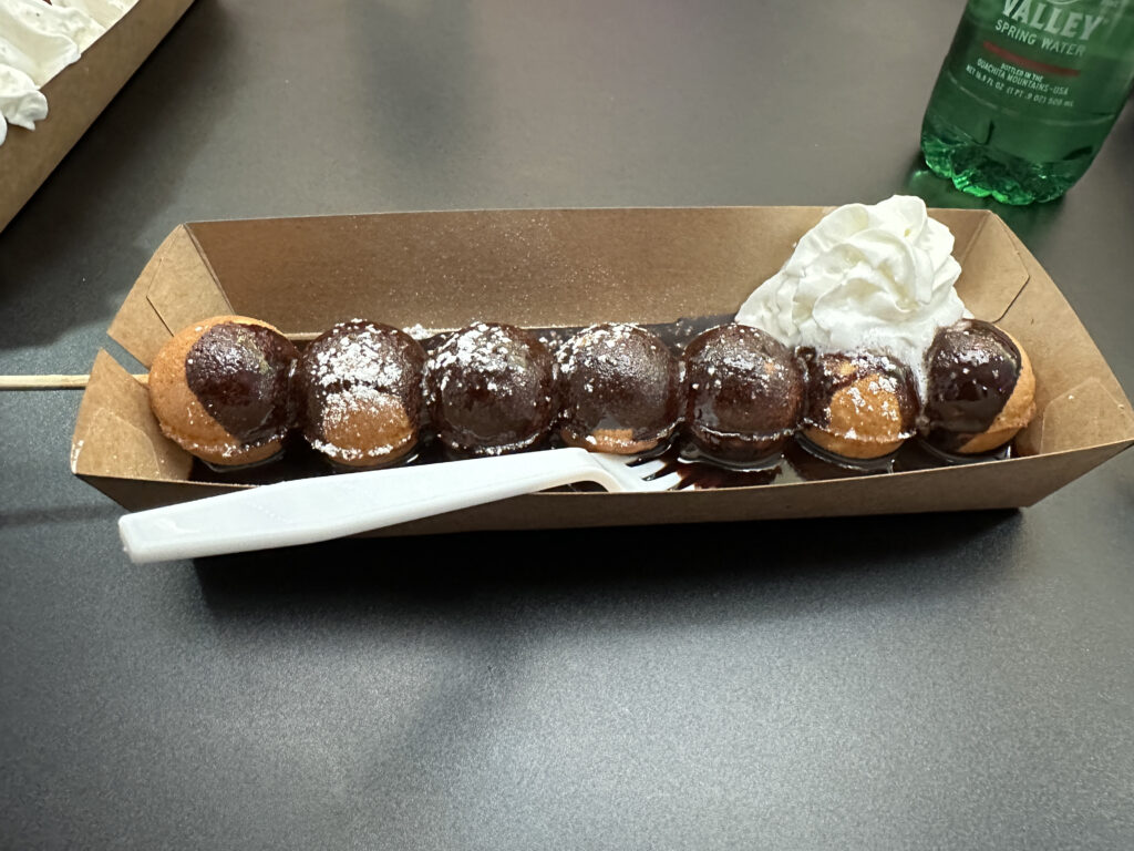 a box of desserts with a fork and a knife