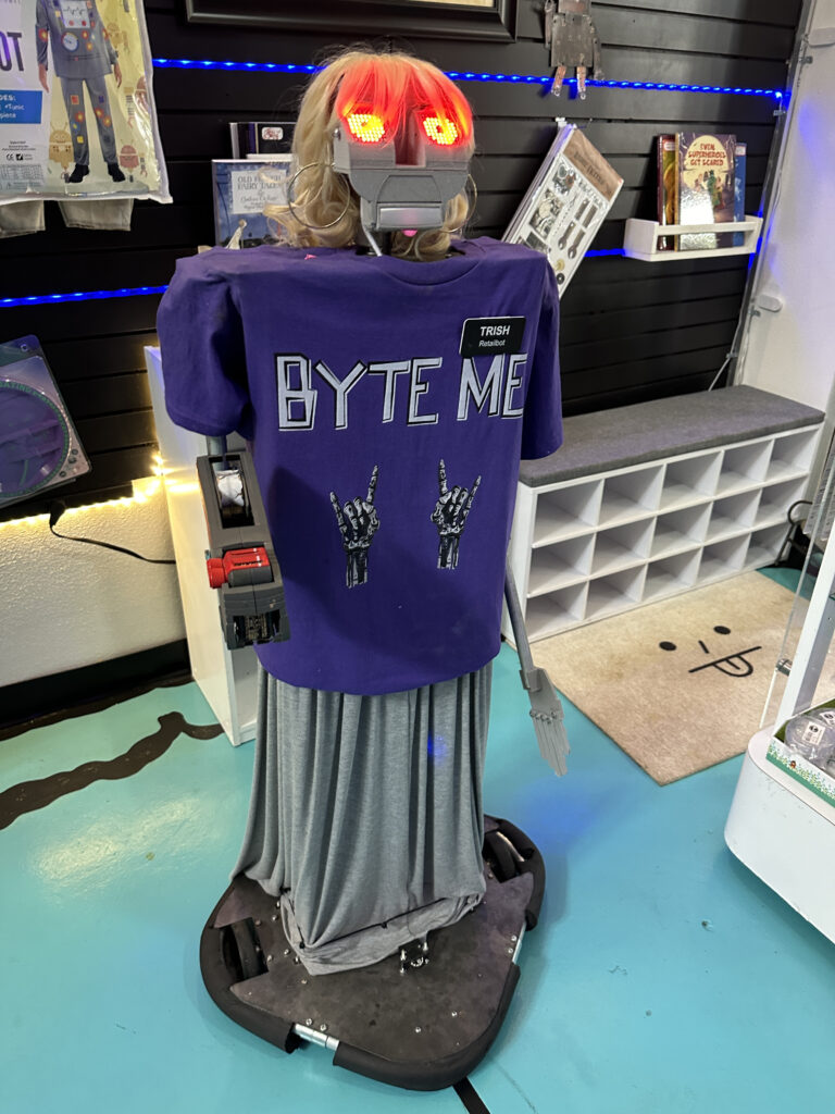 a mannequin wearing a purple shirt and a blue shirt