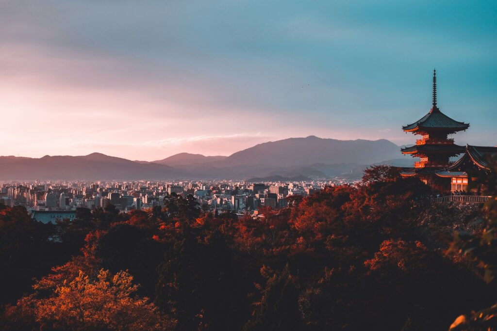 a city landscape with mountains in the background