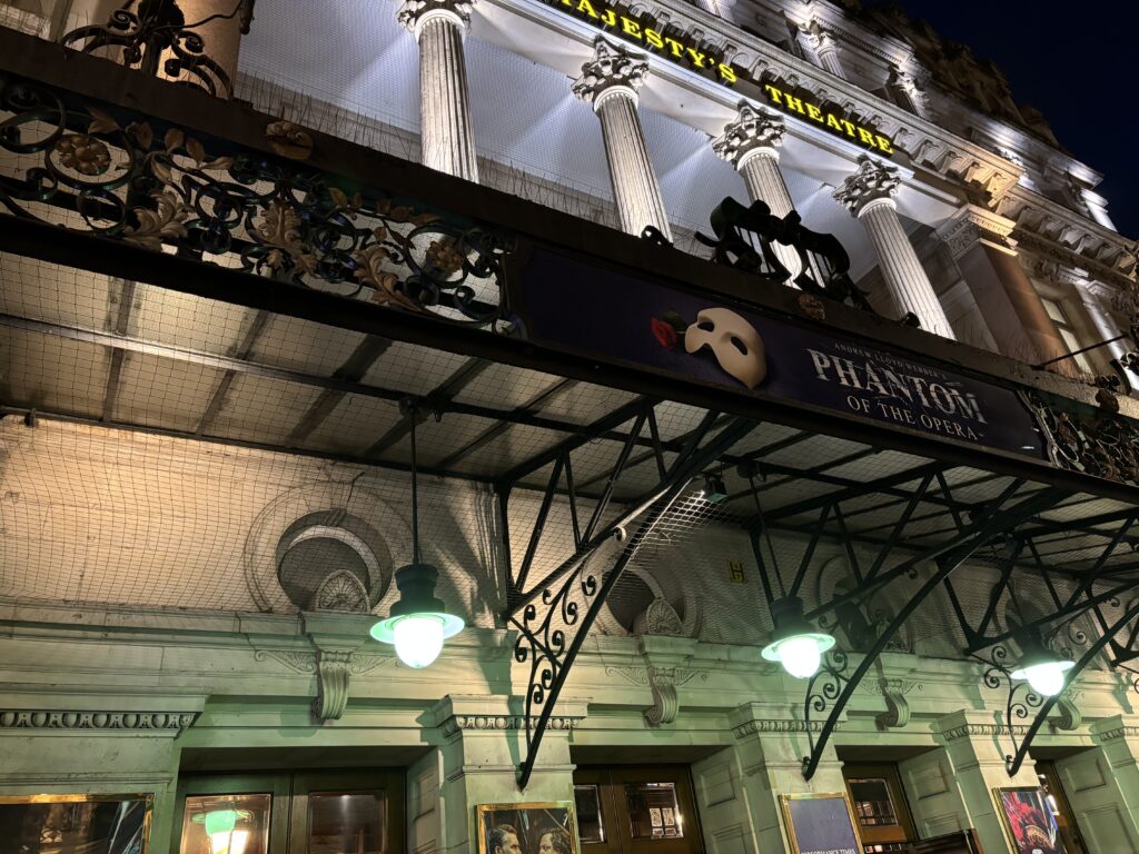 a building with columns and a sign