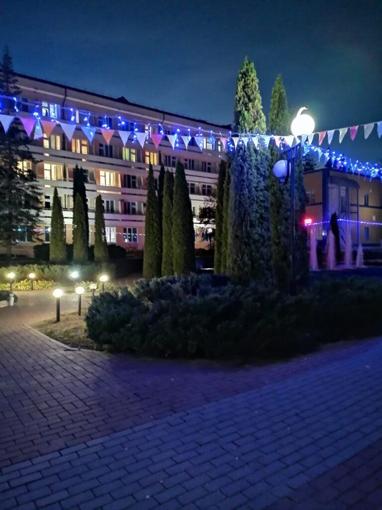 a building with lights and trees