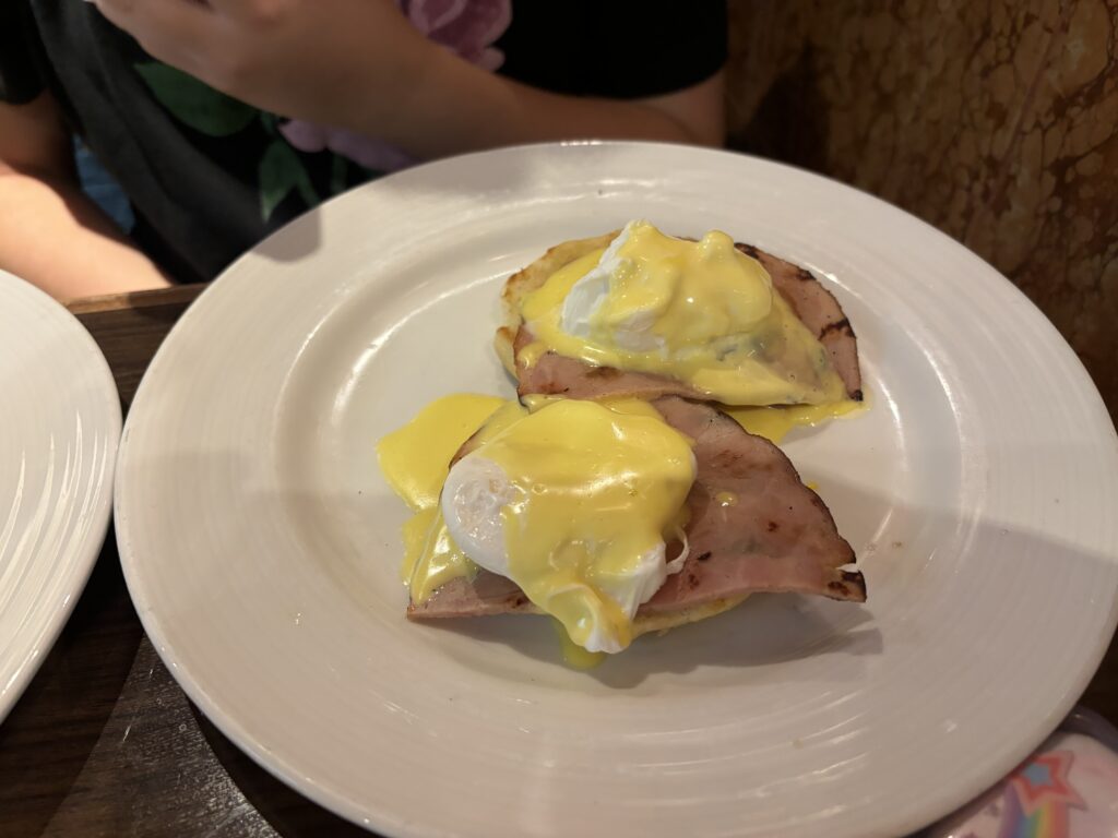 a plate of food with eggs and ham