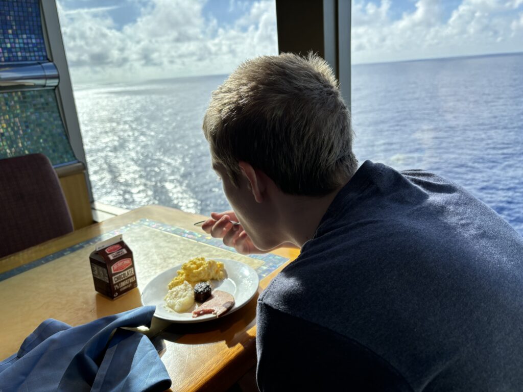 a man eating food at a table