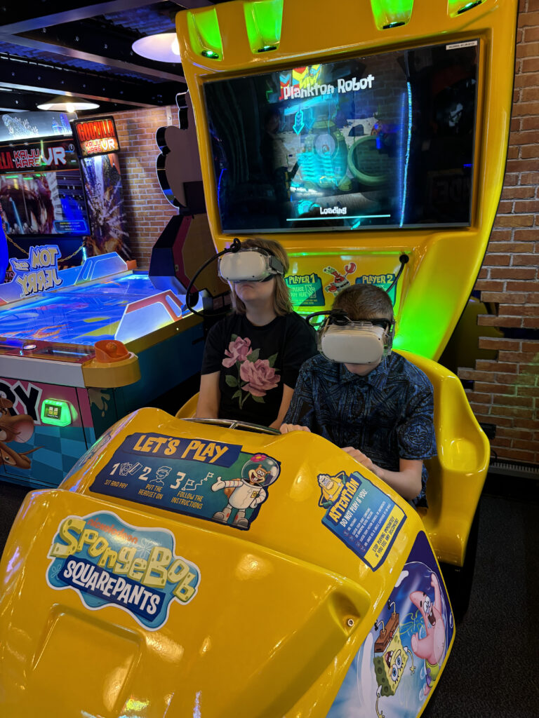 two people wearing virtual reality goggles