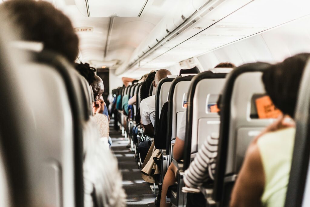a group of people sitting on an airplane