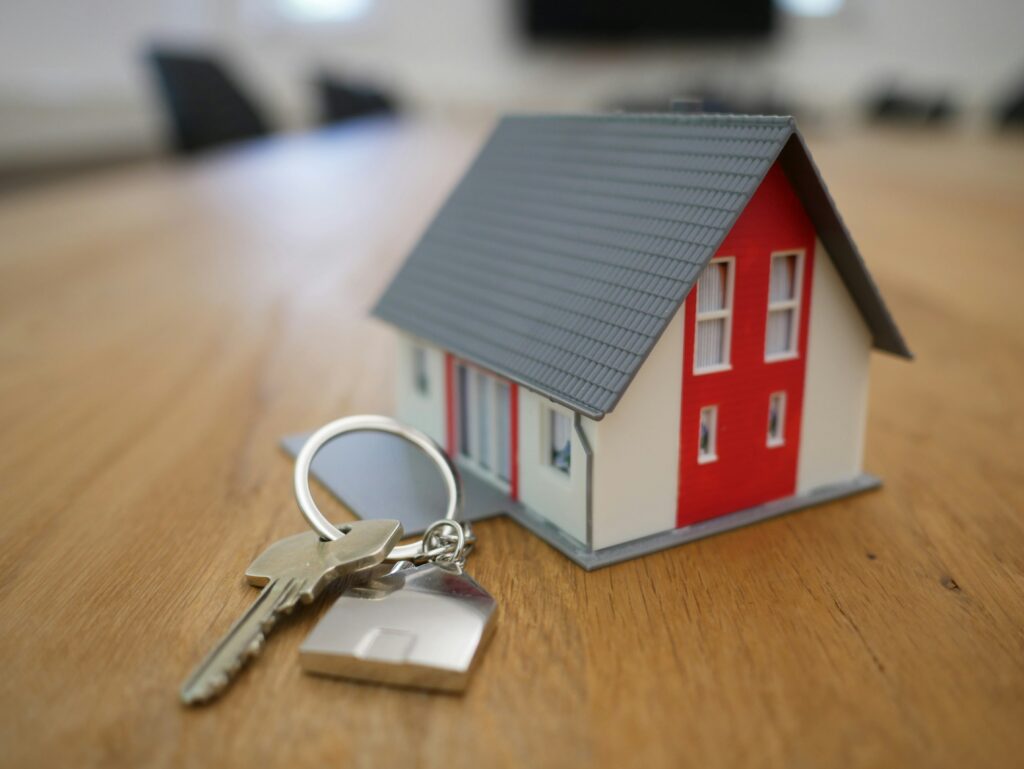 a house and key on a table