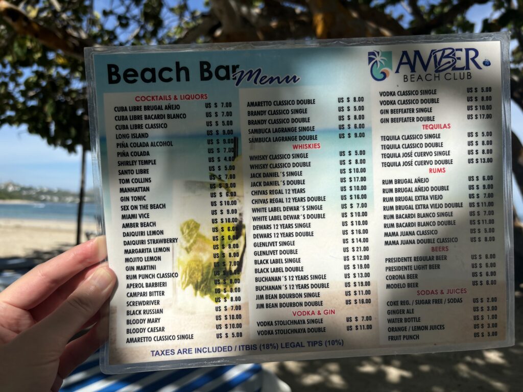 a hand holding a menu