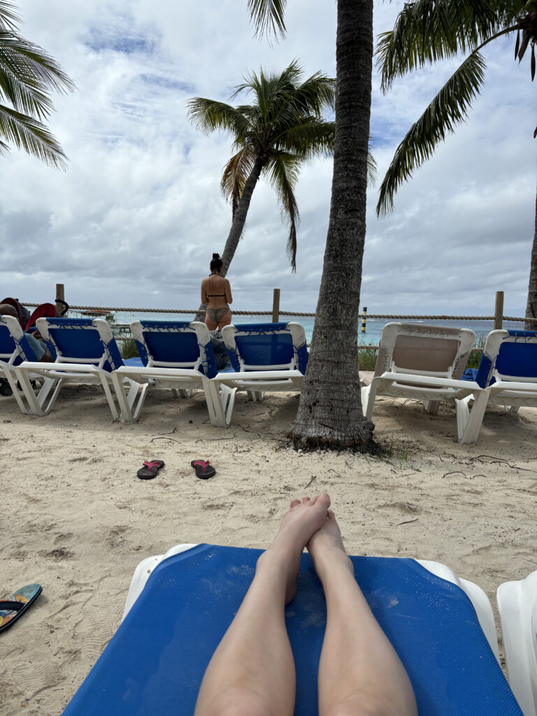 a person's legs on a beach chair