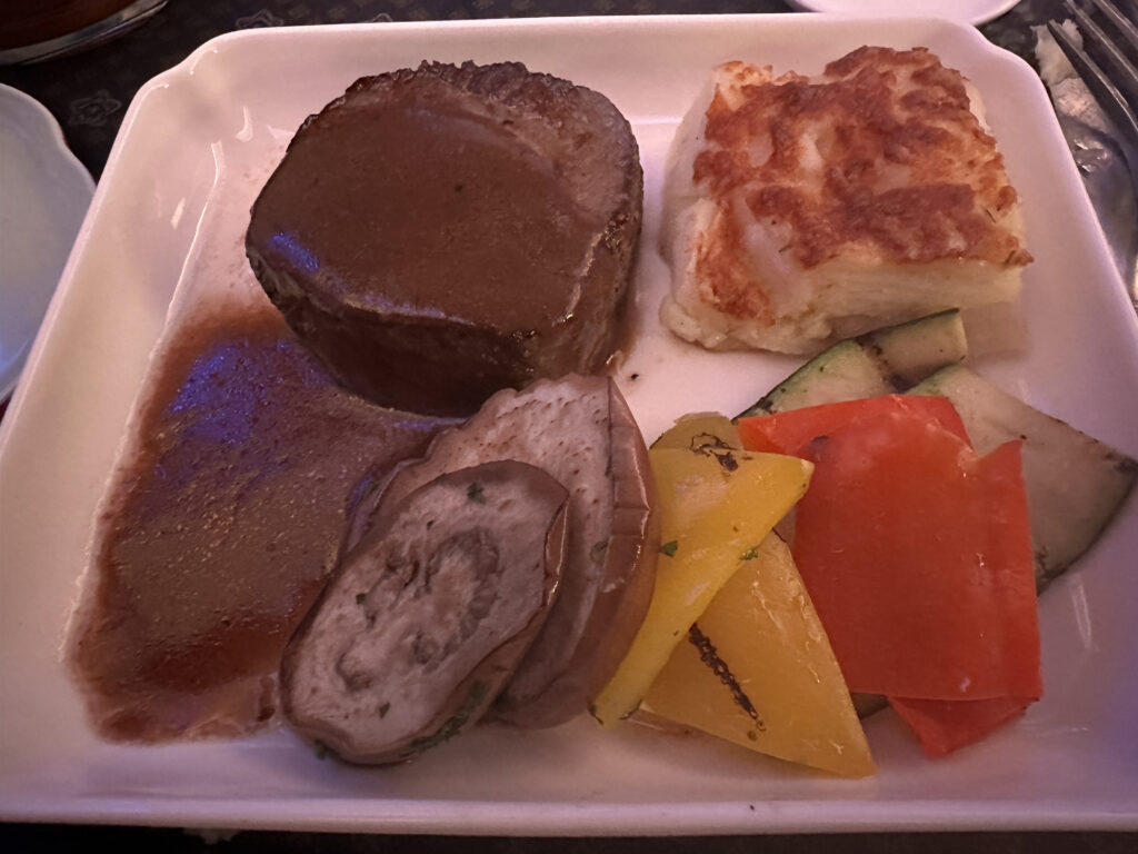 a plate of meat and vegetables